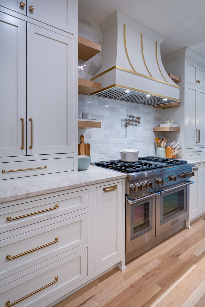 Dual oven setup and custom hood in bright kitchen remodel by Silver Oak Remodel in Atlanta, GA
