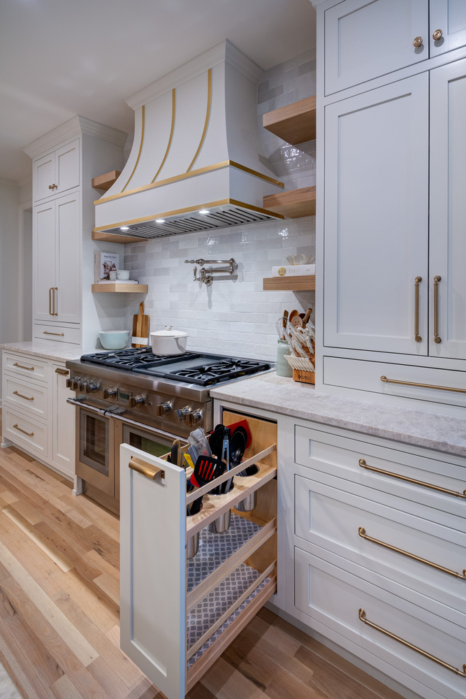 Luxury kitchen remodel with pull-out utensil storage and gas range by Silver Oak Remodel in Atlanta, GA