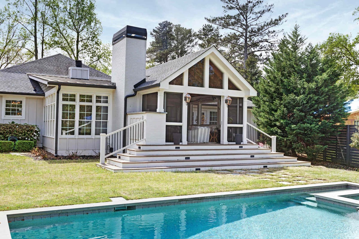 Silver Oak Remodel’s addition in East Cobb GA with screened porch and poolside view