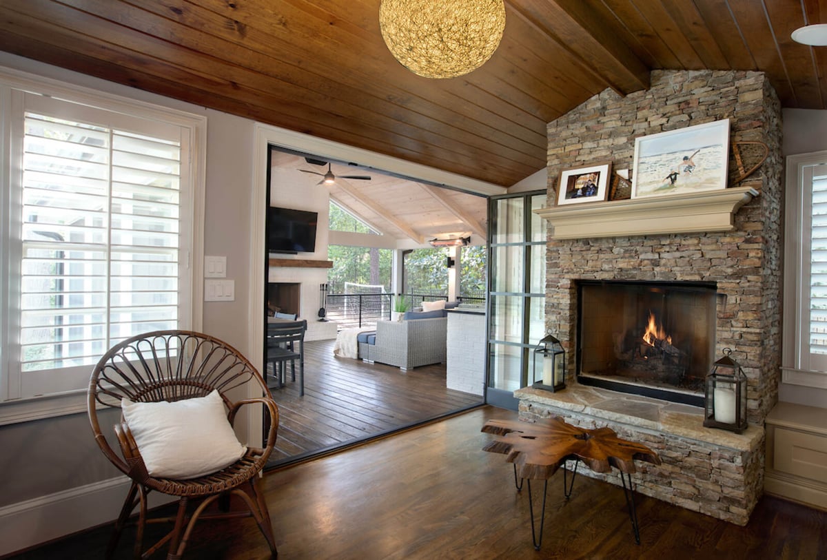 Cozy sunroom addition with stone fireplace by Silver Oak Remodel in Greater Atlanta