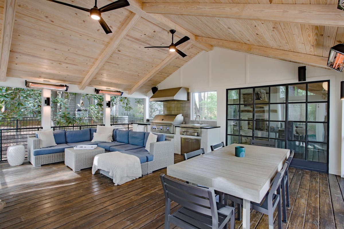 Sunroom addition with vaulted ceiling and dining space by Silver Oak Remodel in Greater Atlanta