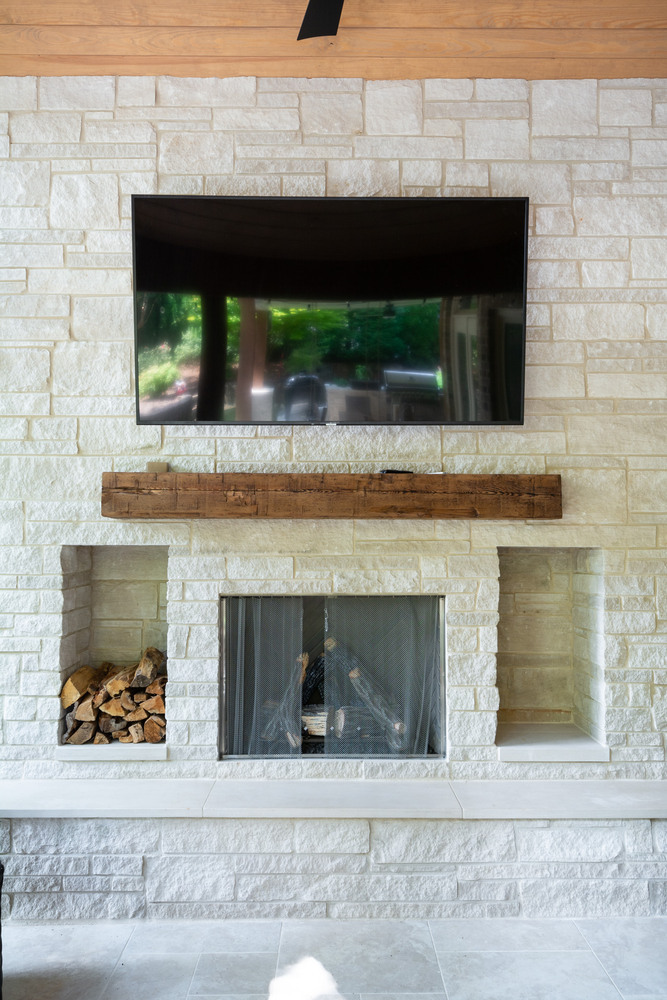 Built-in outdoor kitchen with grill and smoker in backyard remodel by Silver Oak Remodel in Atlanta, GA