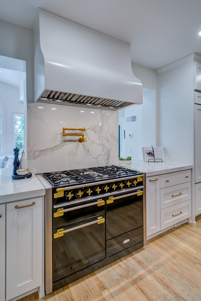 Close-up of professional kitchen range and custom hood by Silver Oak Remodel in Greater Atlanta remodel