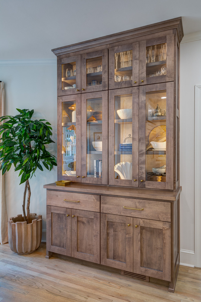 Detailed view of glass-front dining cabinet in Greater Atlanta remodel by Silver Oak Remodel