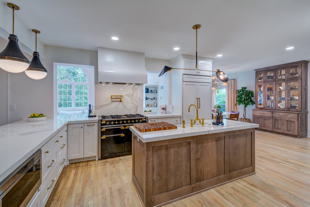 Full kitchen remodel with statement range and marble backsplash by Silver Oak Remodel in Greater Atlanta
