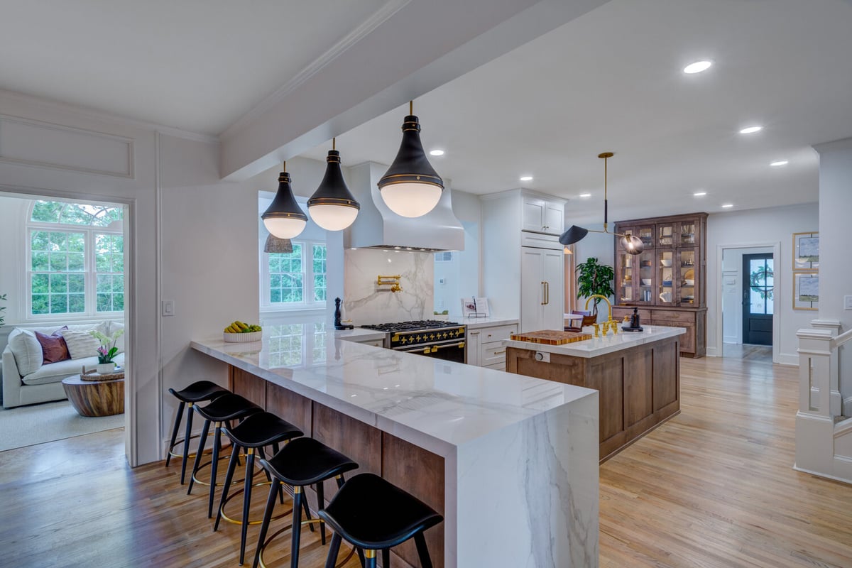 Greater Atlanta kitchen remodel with long marble island and pendant lighting by Silver Oak Remodel