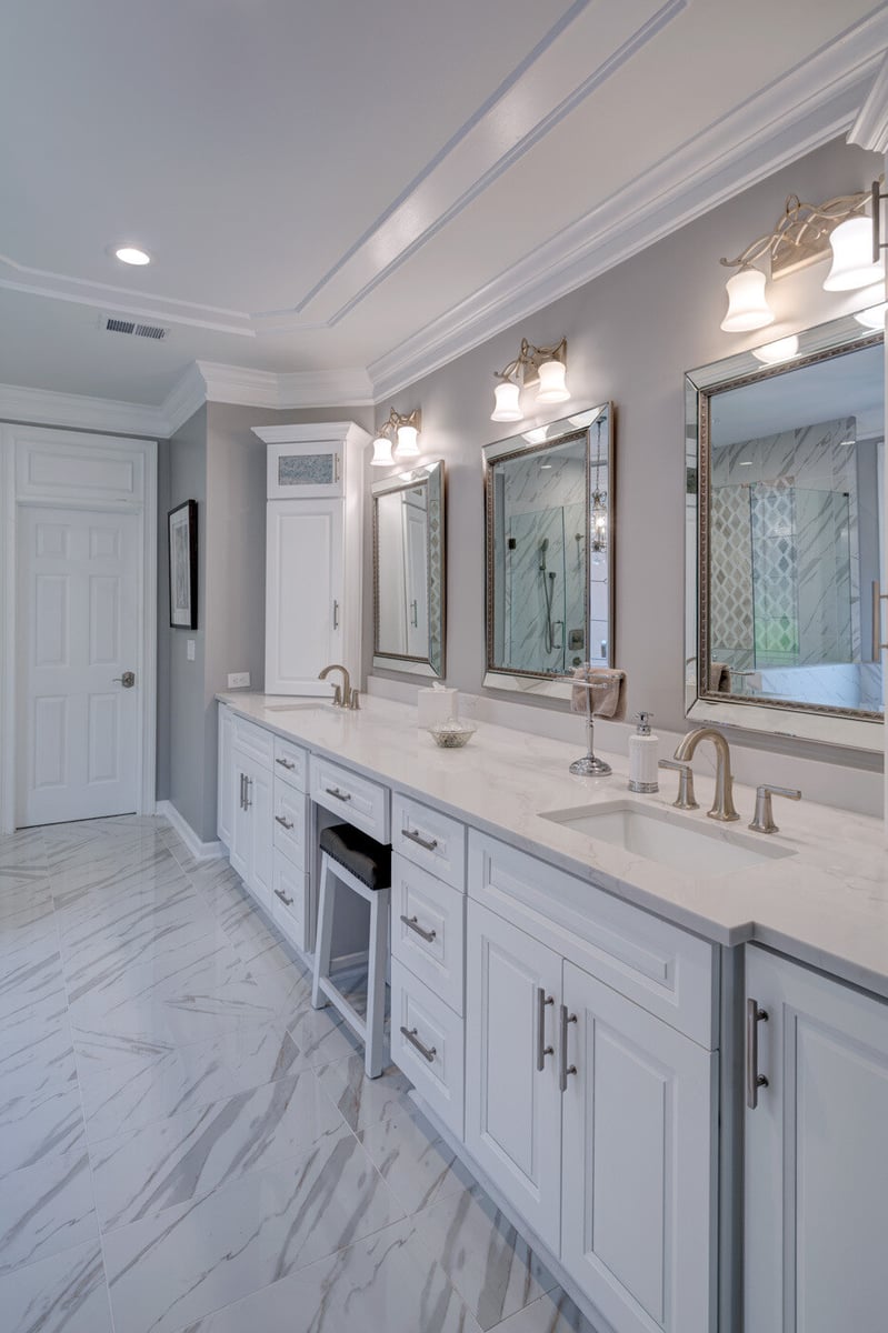 Double vanity with white cabinetry and marble countertop in Sandy Springs bathroom remodel by Silver Oak Remodel