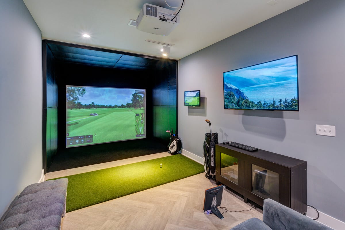 Modern home golf simulator room with TrackMan setup by Silver Oak Remodel in Greater Atlanta